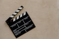 Filmmaking concept. Movie Clapperboard. Cinema begins with movie clappers. Movie clapper on a light texture background and popcorn Royalty Free Stock Photo