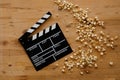Filmmaking concept. Movie Clapperboard. Cinema begins with movie clappers. Movie clapper on an old wooden background and a Royalty Free Stock Photo