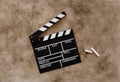 Filmmaking concept. Movie Clapperboard. Cinema begins with movie clappers. Movie clapper board on a textural background Royalty Free Stock Photo