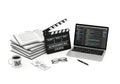 Filmmaking tools including a clapperboard script pages laptop and coffee cup for creative production Royalty Free Stock Photo