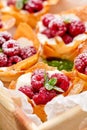 Filo cups with Mascarpone filling topped with raspberries , delicious dessert