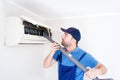 Filter cleaning service maintenance of an air conditioner indoor unit Royalty Free Stock Photo