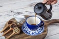 Filter coffee. The steam from Pouring coffee into cup , A cup of fresh coffee. A scattering of coffee beans with a cup of coffee. Royalty Free Stock Photo