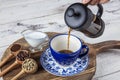 Filter coffee. The steam from Pouring coffee into cup , A cup of fresh coffee. A scattering of coffee beans with a cup of coffee. Royalty Free Stock Photo