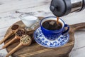 Filter coffee. The steam from Pouring coffee into cup , A cup of fresh coffee. A scattering of coffee beans with a cup of coffee. Royalty Free Stock Photo