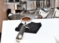 filter holder filled with freshly ground coffee. espresso accessory. Royalty Free Stock Photo