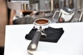 Filter holder filled with freshly ground coffee. Espresso accessory. Royalty Free Stock Photo