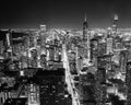Filtered black and white image aerial view illuminated skyscrapers in downtown Chicago at dusk Royalty Free Stock Photo