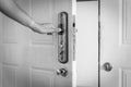 Filtered image Asian male hand open door knob of apartment in Hanoi, Vietnam Royalty Free Stock Photo