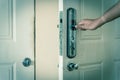 Filtered image Asian male hand open door knob of apartment in Hanoi, Vietnam Royalty Free Stock Photo