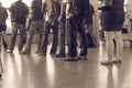 Filtered image crowded Asian commuters queuing at train station in Singapore Royalty Free Stock Photo