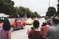 Filtered image diverse people waving American flag on Independence Day Street Parade Celebration