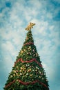 Filtered image sixty foot Christmas tree with colorful baubles and lighting display in Texas, America Royalty Free Stock Photo