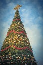 Filtered image sixty foot Christmas tree with colorful baubles and lighting display in Texas, America Royalty Free Stock Photo