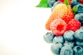 Filtered image studio shot pile of organic strawberries, blueberries and raspberries collection isolated Royalty Free Stock Photo
