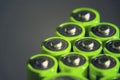 Stack of green AA batteries close up, electricity storage concept Royalty Free Stock Photo