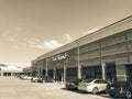 Filtered tone entrance of Tom Thumb grocery store under cloud bl