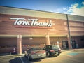 Filtered tone entrance of Tom Thumb grocery store under cloud bl