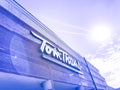 Filtered tone logo entrance of Tom Thumb grocery store under cloud blue sky in USA