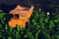 Filtered vintage orange car toy truck on green grass detail Royalty Free Stock Photo