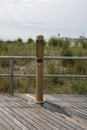 Filtered water bottle filler on a boardwalk neat a beach sand dune with high grass Royalty Free Stock Photo