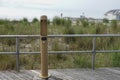 Filtered water bottle filler on a boardwalk neat a beach sand dune with high grass Royalty Free Stock Photo