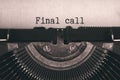 Final call words typed on an old vintage typewriter in black and white