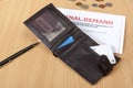 Final demand letter on a desk with a wallet