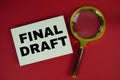 Final Draft text written on paper with magnifying glass Royalty Free Stock Photo
