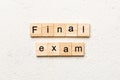 final exam word written on wood block. final exam text on table, concept Royalty Free Stock Photo