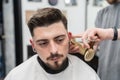 Making Male Haircut. Hair and beard care.