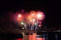 final rainbow fireworks on beach and reflection color on water surface Royalty Free Stock Photo