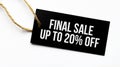 FINAL SALE UP TO 20 percents text on a black tag on a white paper background Royalty Free Stock Photo