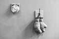 Final sparring. Vintage boxing gloves hang on hook wall background. Boxing gloves and ring bell. Boxing career famous Royalty Free Stock Photo