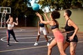 Finally a break to pass the ball. a diverse group of sportswomen playing a competitive game of basketball together