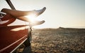 Finally a chance to kick back and relax. an unrecognizable womans legs sticking out the window of a car along the coast. Royalty Free Stock Photo