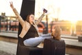 Finally on vacation. Woman celebrating at train station.