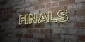 FINALS - Glowing Neon Sign on stonework wall - 3D rendered royalty free stock illustration