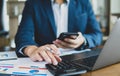 Finance and accounting concept. business woman working on desk using calculator to calculate Royalty Free Stock Photo