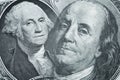Finance background. Combined image of Benjamin Franklin and George Washington portraits on the US 100 and 1 dollar bill. Macro