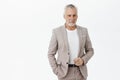 Finance, business and success concept. Portrait of rich senior male entrepreneur in elegant suit with grey hair and