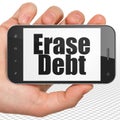 Finance concept: Hand Holding Smartphone with Erase Debt on display