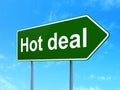 Finance concept: Hot Deal on road sign background Royalty Free Stock Photo