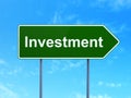 Finance concept: Investment on road sign background Royalty Free Stock Photo