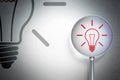 Finance concept: Light Bulb with optical glass on digital background Royalty Free Stock Photo