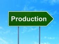 Finance concept: Production on road sign background Royalty Free Stock Photo