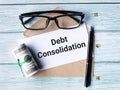 Text Debt consolidation written on white paper