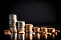 Finance and economics concept with stacks of coins on black background Royalty Free Stock Photo