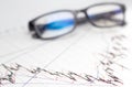 Finance, financial analysis, accounting accounts spreadsheet with glasses Royalty Free Stock Photo