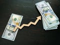 Finance success and investment. Stack of money and arrow Royalty Free Stock Photo